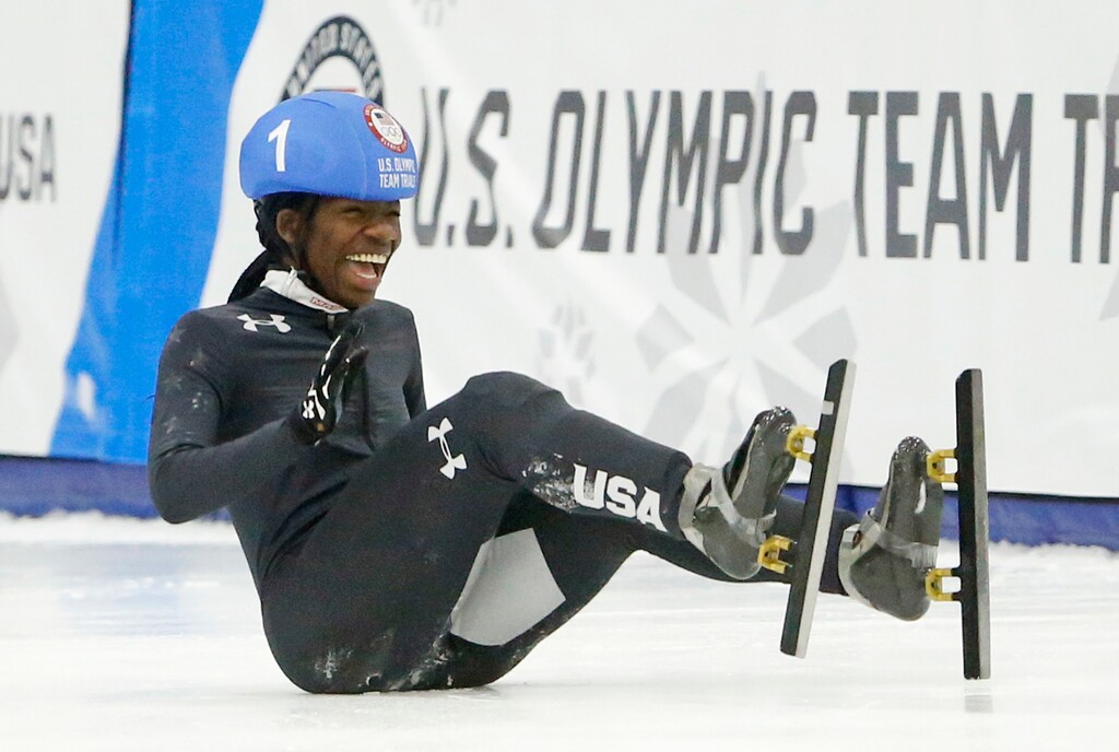 Maame Biney (1) falls as she reacts after winning women's 500-meter A final race during the U.S. Olympic short track speedskating trials Saturday, Dec. 16, 2017, in Kearns, Utah. (AP Photo/Rick Bowmer)