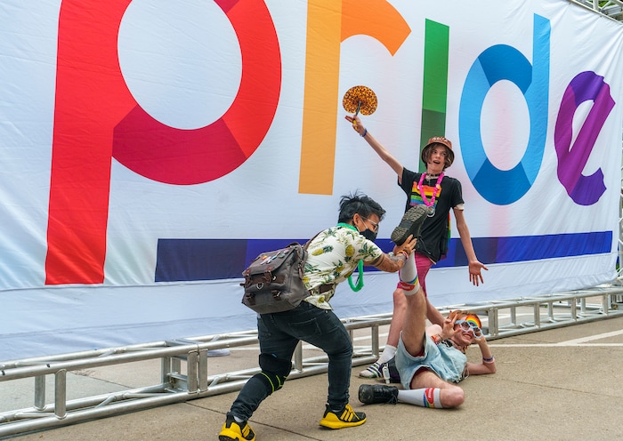 (Leah Hogsten | The Salt Lake Tribune) L-R Julien Doria, Ari Webb and his brother Avery Webb pose for photos at  the Utah Pride Festival at Washington Square, Saturday, June 4, 2022. 
