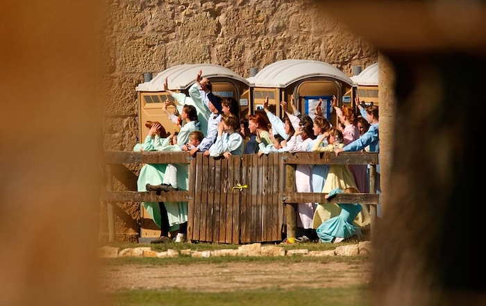 (Trent Nelson | The Salt Lake Tribune)
San Angelo, Texas - Young FLDS women gather behind a fence at Fort Concho, waving to other FLDS women in another building out of view. Texas Child Protective Services and Texas State Troopers made every effort to keep the nearly 500 women and children in custody out of view, going so far as to confiscate cel phones and other electronic devices.
