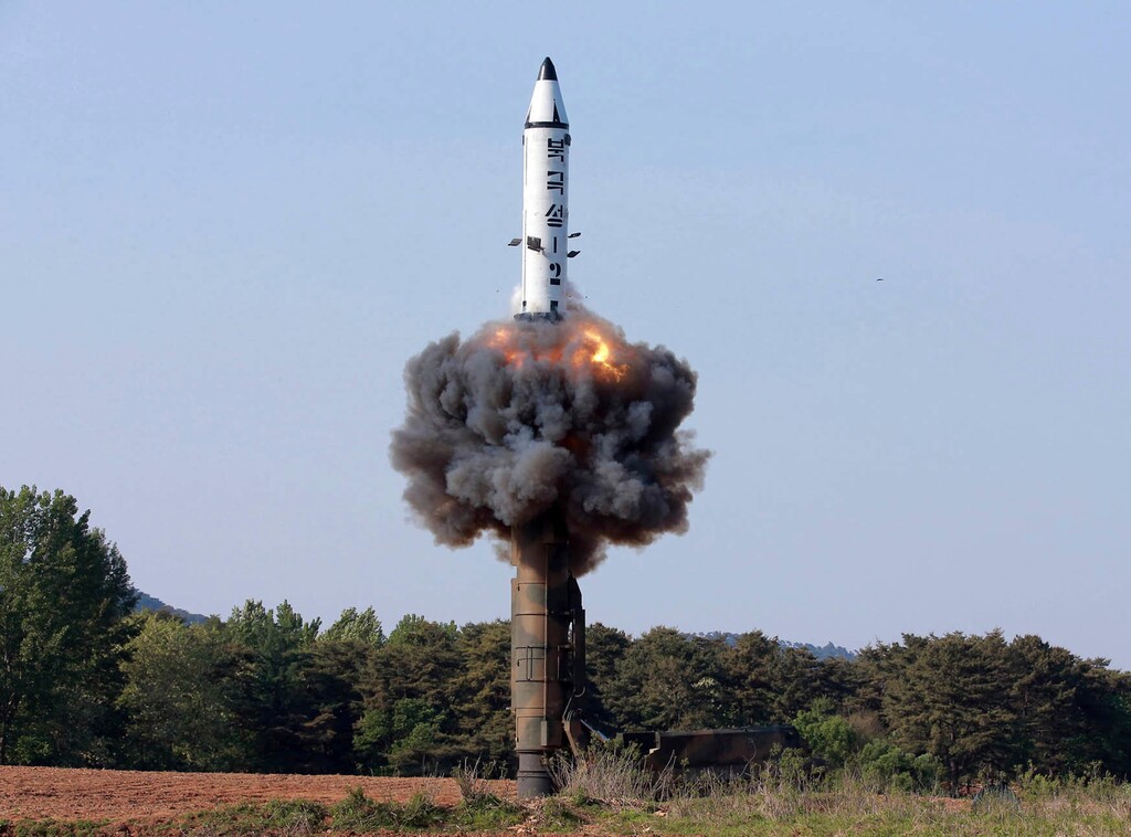 (Korean Central News Agency | Korea News Service | The Associated Press) In this undated file photo distributed by the North Korean government on May 22, 2017, a solid-fuel "Pukguksong-2" missile lifts off during its launch test at an undisclosed location in North Korea. Seven months ahead of the Pyeongchang Olympics, many in South Korea, including new liberal President Moon Jae-in, hope to use the Games as a venue to promote peace with rival North Korea. To do so, the North’s participation is essential, but an ongoing nuclear tension and a lack of winter sports athletes in North Korea could ruin the attempts at reconciliation.