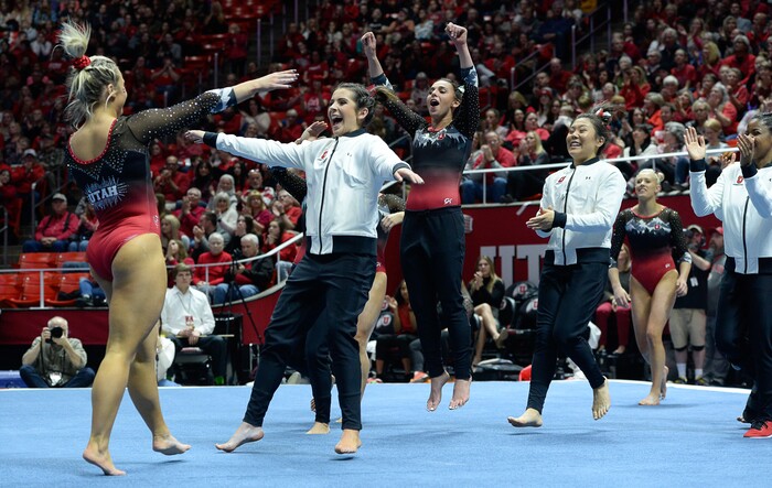 (Francisco Kjolseth  |  The Salt Lake Tribune)  Sydney Soloski is celebrated by her teammates after her floor routine as Utah hosts Penn State in their season opener at the Huntsman Center in Salt Lake City on Saturday, Jan. 5, 2019.