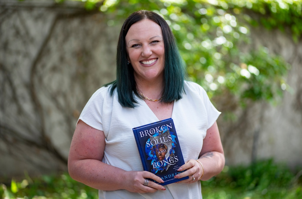 (Rick Egan | The Salt Lake Tribune)  LJ Andrews with her book "Broken Souls and Bones" on Monday, April 28, 2025.