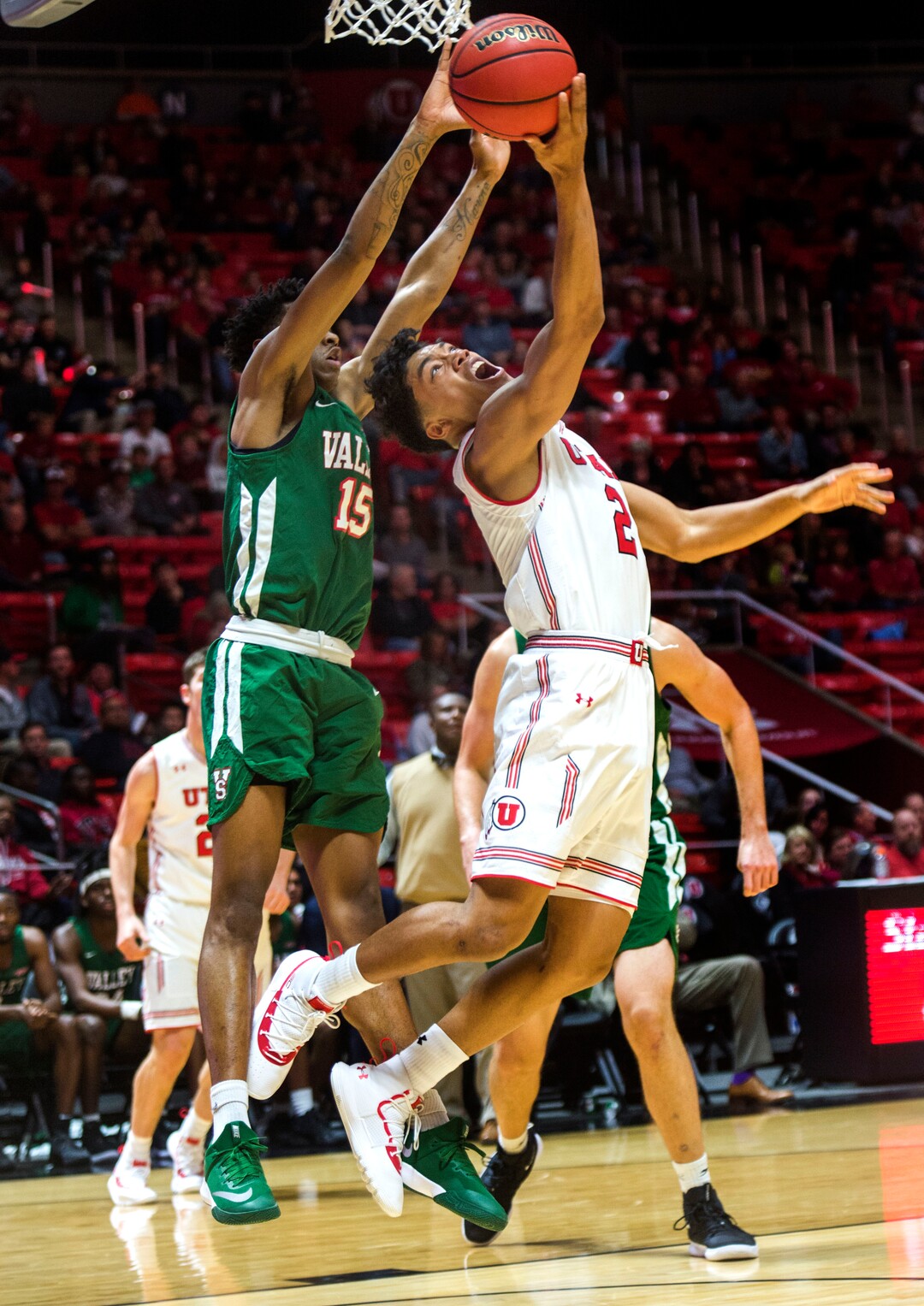 (Rick Egan  |  The Salt Lake Tribune)    Utah Utes guard Sedrick Barefield (2) takes the ball to the hoop, as Mississippi Valley State Delta Devils guard Michael Green (15) defends, in basketball action between Utah Utes and Mississippi Valley State Delta Devils at the Jon M. Huntsman Center, Thursday, Nov. 15, 2018.