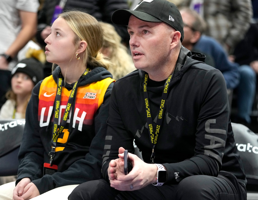 (Leah Hogsten | The Salt Lake Tribune) Utah Gov. Spencer Cox and his daughter EmmaKate, left, watch a Jazz game in 2023. The governor is now celebrating a courtroom victory against Kalshi.