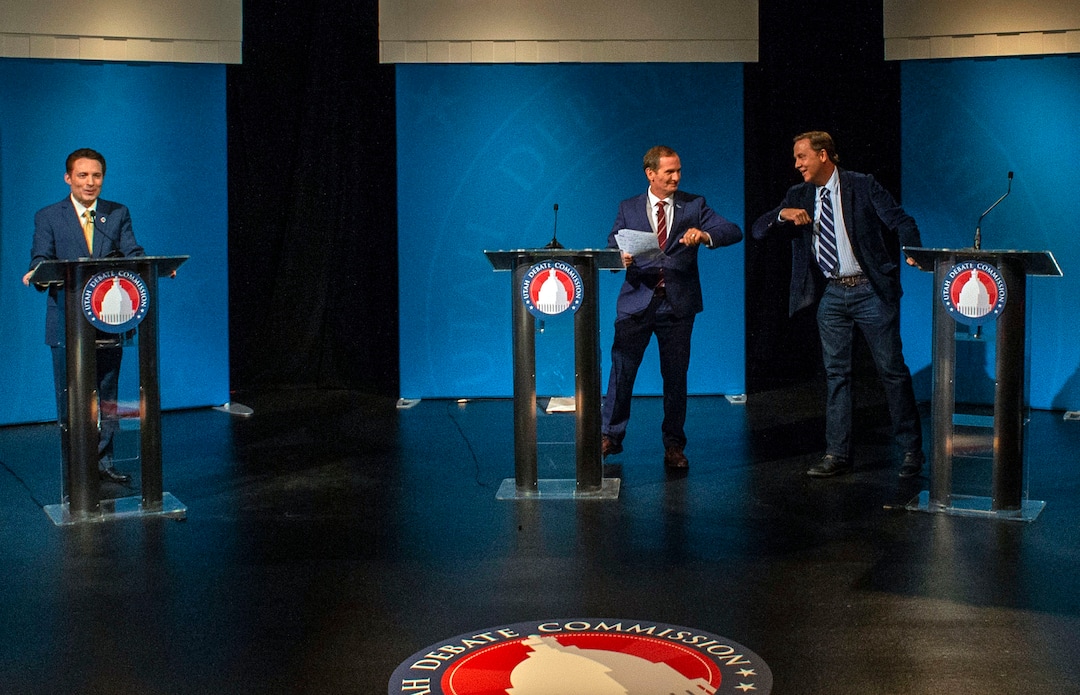 (Rick Egan  |  The Salt Lake Tribune)     Chris Stewart (R) bumps elbows with Kael Weston (D), at the end of the Utah 2nd Congressional District debate between J. Robert Latham (L), Chris Stewart (R) and Kael Weston (D), at KSL Studio in Salt Lake City, on Monday, October 19, 2020