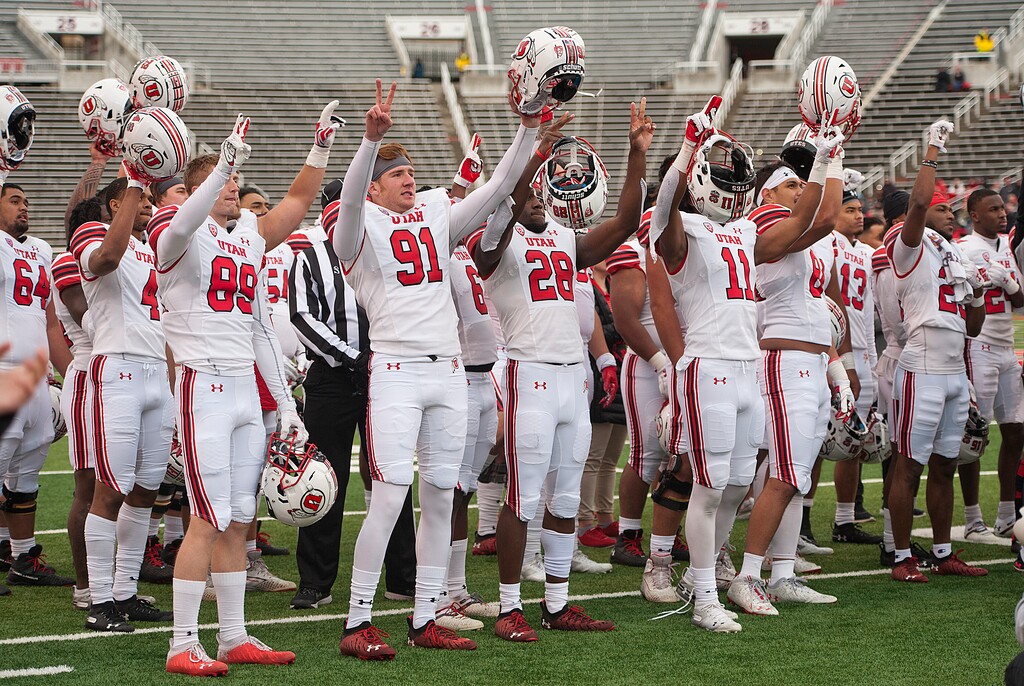 (Ed Kosmicki | Special to The Tribune) Members of the white team remember teammates Ty Jordan and Aron Lowe during the Utah football spring game at Rice-Eccles Stadium, Saturday, April 23, 2022.