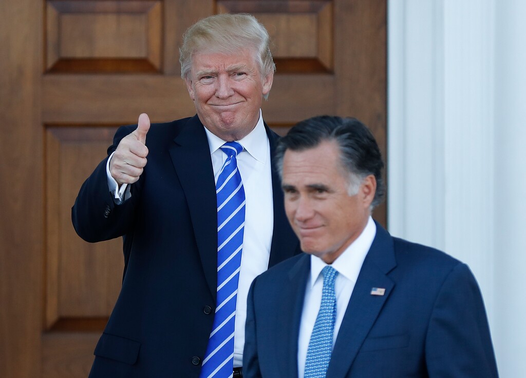 (Carolyn Kaster | The Associated Press) In this Nov. 19, 2016, file photo, shows President-elect Donald Trump giving the thumbs-up as Mitt Romney leaves Trump National Golf Club Bedminster in Bedminster, N.J.  Mitt Romney and President Donald Trump exchanged harsh criticisms of one another during the 2016 presidential campaign but also have a history of being willing to sit down with each other when mutually beneficial. Romney's announcement that he's running for the U.S. Senate seat in Utah creates the potential for future battles, or even deal-making.