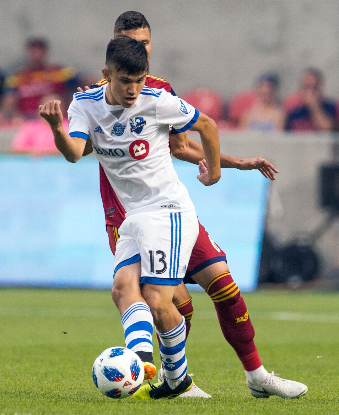 Real Salt Lake midfielder Damir Kreilach (6) goes for the ball along with Montreal Impact midfielder Samuel Piette (6) in MLS soccer game action in Sandy, Utah, Saturday, Aug. 11, 2018. (Rick Egan/The Salt Lake Tribune via AP)