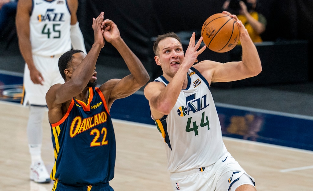 (Rick Egan | The Salt Lake Tribune) Utah Jazz forward Bojan Bogdanovic (44) goes in for a layup, as Golden State Warriors forward Andrew Wiggins (22) defends, in NBA action between the Utah Jazz and the Golden State Warriors at Vivint Arena, on  Saturday, Jan. 23, 2021.