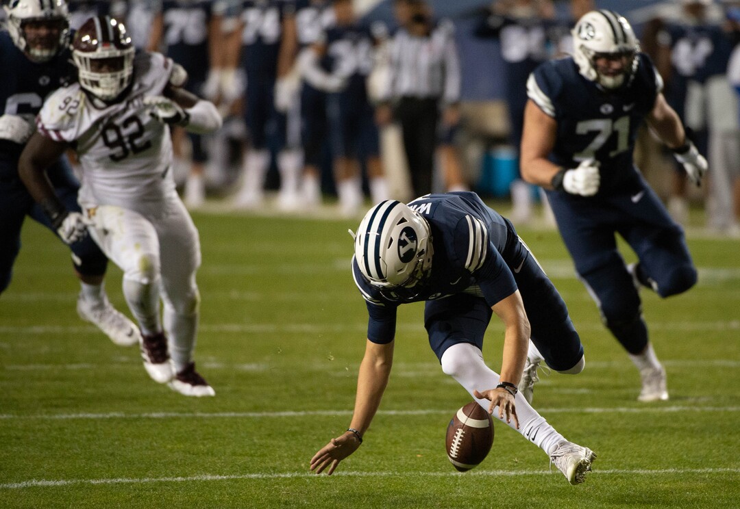 (Francisco Kjolseth  |  The Salt Lake Tribune) Brigham Young Cougars quarterback Zach Wilson (1) fumbles a snap recovered by Texas State near the end zone before the defensive lineup was able to stop any attempts at a touchdown by Texas State during an NCAA college football game at LavVell Edwards Stadium, Saturday, oct. 24, 2020, in Provo, Utah.