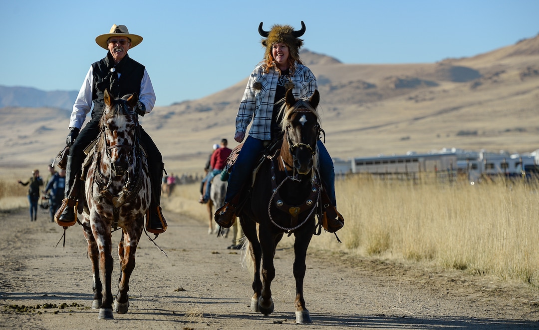 (Francisco Kjolseth  |  The Salt Lake Tribune)  Don Bradshaw is joined by his daughter KyAnn Betz as the pair join other riders on horseback to herd bison during the 33rd annual roundup, Saturday, Oct. 26, 2019, on Antelope Island, a state park located near Syracuse in Davis County. Every year Utah wildlife and parks officials move the animals from across the island so they can be weighed, tagged and given health screenings.