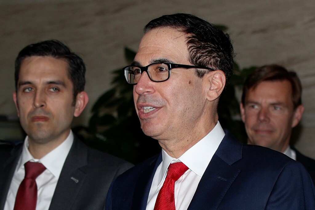 U.S. Treasury Secretary Steven Mnuchin, center, speaks to the media upon his arrival at a hotel in Beijing, Tuesday, April 30, 2019. Mnuchin arrived in China's capital to hold a new high-level trade talks with China on May 1. (AP Photo/Andy Wong)
