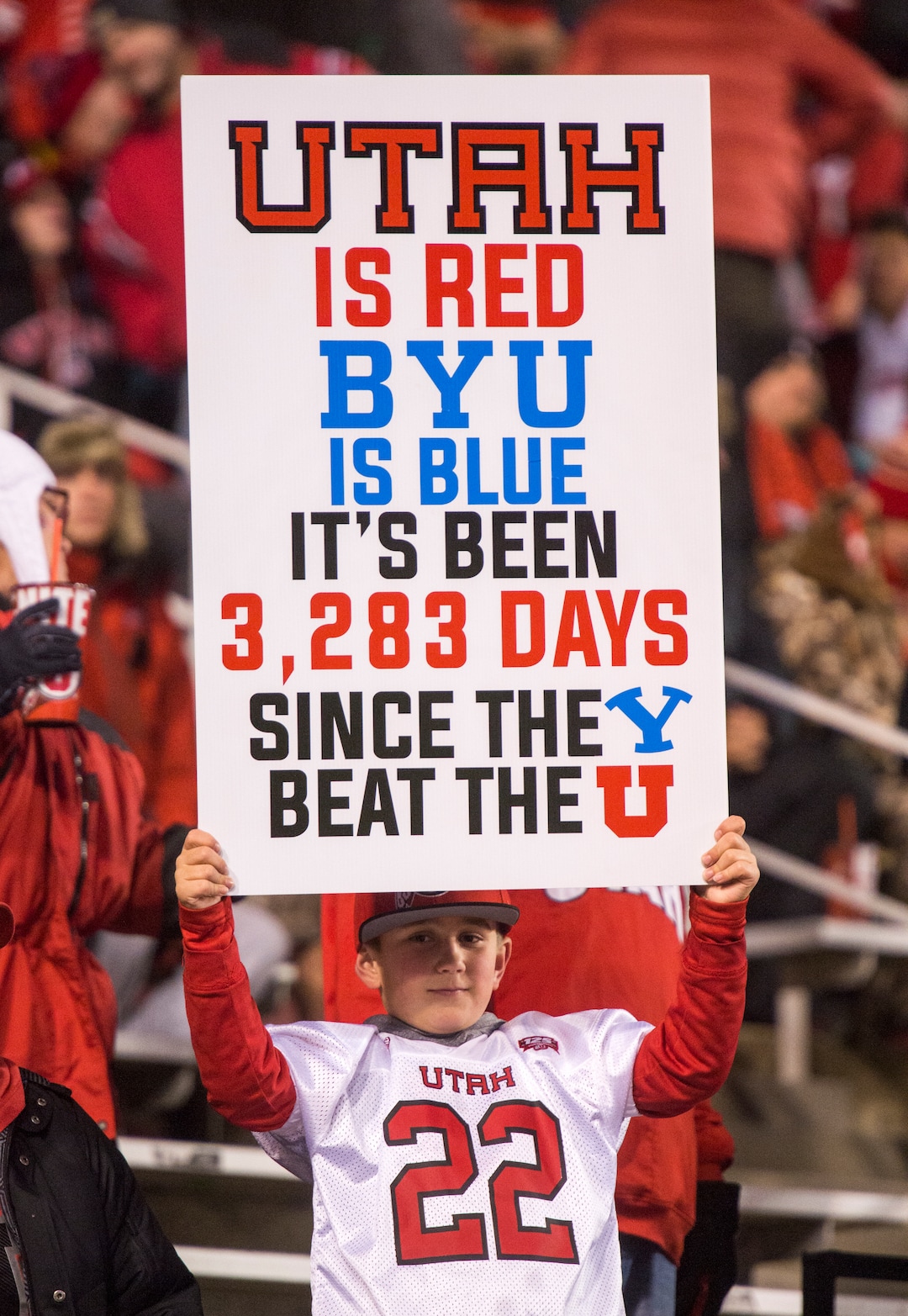 (Rick Egan  |  The Salt Lake Tribune)      Alton Dahl, 9, from Farmington, holds a sign before football action between the Brigham Young Cougars and the Utah Utes, at Rice-Eccles Stadium, Saturday, November 24, 2018.