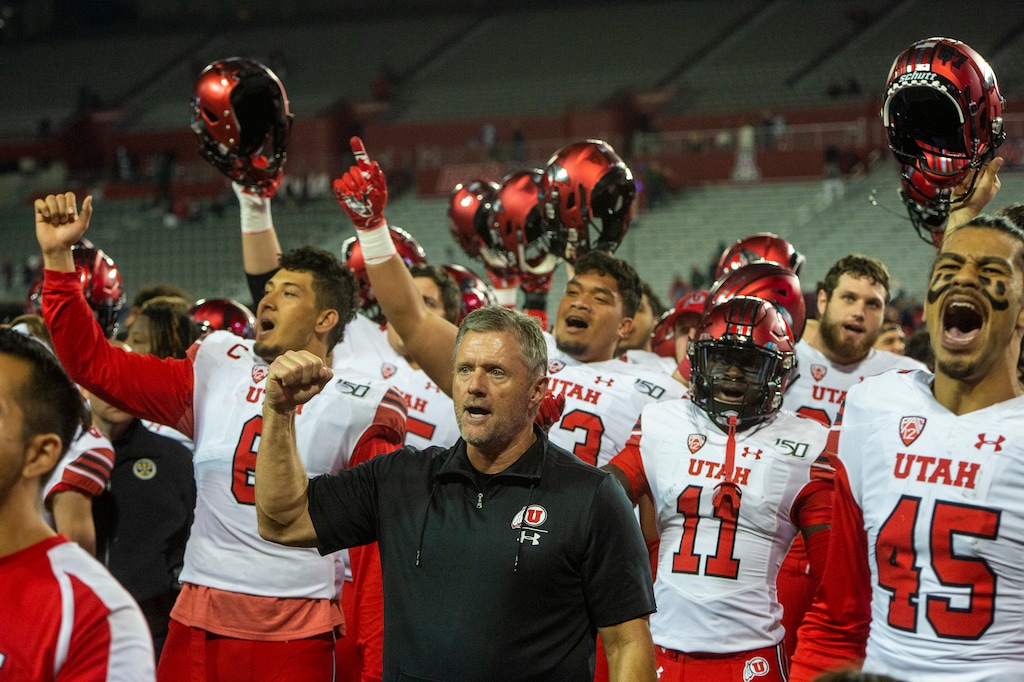 (Rick Egan  |  The Salt Lake Tribune)      Utah Utes head coach Kyle Whittingham sings with his team after they defeated the Wildcats, 35-7, in PAC-12 action between the Utah Utes and the Arizona Wildcats in Tucson, Saturday, Nov. 23, 2019.