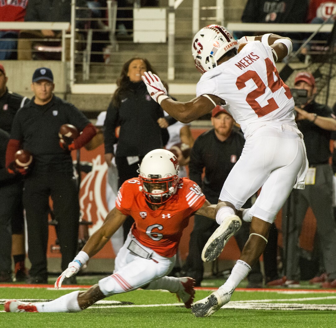 (Rick Egan  |  The Salt Lake Tribune)  Utah Utah Utes wide receiver Kyle Fulks (6) tries to stop Stanford Cardinal cornerback Quenton Meeks (24) after he intercepted  a pass, in PAC-12 football action, at Rice-Eccles Stadium, Saturday, October 7, 2017.