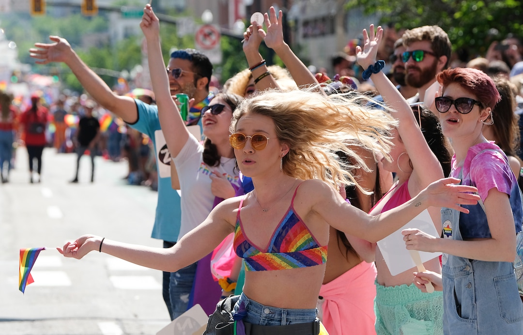 (Francisco Kjolseth  |  The Salt Lake Tribune)  Vayanna Kruse dances as the parades roll by as thousands participate in the Utah Pride Parade in Salt Lake City on Sunday June 2, 2019.