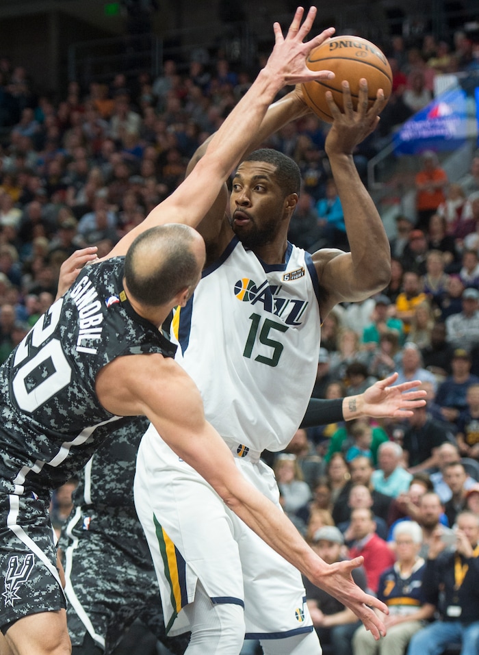 (Rick Egan  |  The Salt Lake Tribune)   Utah Jazz forward Derrick Favors (15) looks for a shot, as San Antonio Spurs guard Manu Ginobili (20) defends, in NBA action, in Salt Lake City, Monday, February 12, 2018.