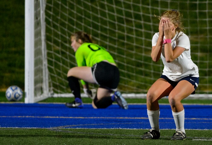(Steve Griffin | The Salt Lake Tribune) Timpanogos midfielder Shaylie Weenig covers her face with here hands after her penalty kick sailed wide during a shootout in the 5A semifinal girl's soccer match against Timpview at Juan Diego High School in Draper Tuesday October 17, 2017. Timpanogos went on to defeat Timpview advancing to the finals.