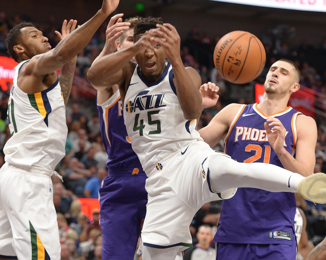 (Leah Hogsten  |  The Salt Lake Tribune) Utah Jazz guard Donovan Mitchell (45) fights for the rebound under the net.  The Utah Jazz defeated the Phoenix Suns 112-101 during preseason NBA basketball at Vivint Smart Home Arena in Salt Lake City, October 6, 2017.