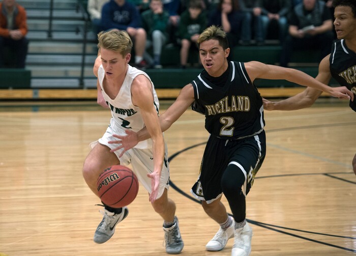 (Scott Sommerdorf   |  The Salt Lake Tribune)   Highland's Liki Makaui pokes the ball from Jacob Dowdell during second half play as Olympus defeated Highland 70-49, Friday, January 19, 2018.