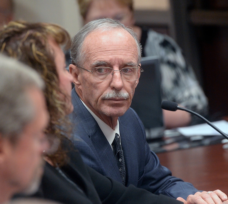 (Al Hartmann  |  Tribune file photo)  In this Oct. 4, 2016, photo, Salt Lake County County Recorder Gary Ott sits with his chief deputy Julie Dole before the Salt Lake County Council's presentation of findings of the county auditor's performance review in Salt Lake City. Salt Lake County District Attorney Sim Gill and Salt Lake County Mayor Ben McAdams said in a statement Thursday, July 20, 2017, that Ott, who has been placed under his family's guardianship after more than a year public questions about his mental capacity will resign his office, would resign his office Aug. 1.
