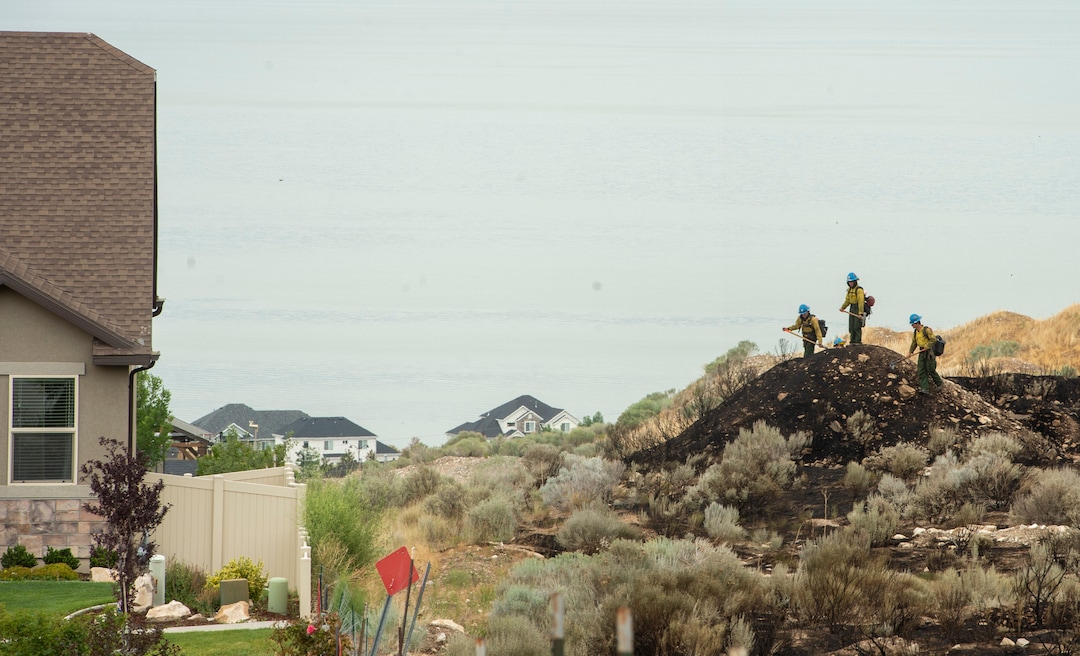 (Rick Egan  |  The Salt Lake Tribune)      Firefighters look for hotspots from the Knolls fire in Saratoga Springs near South Harrier Drive on Monday, June 29, 2020.