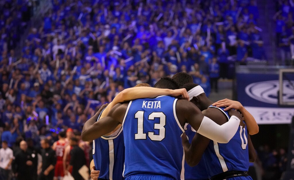 (Bethany Baker  |  The Salt Lake Tribune) Brigham Young Cougars come together before the game between the Brigham Young Cougars and the Utah Utes in Provo on Saturday, March 8, 2025.