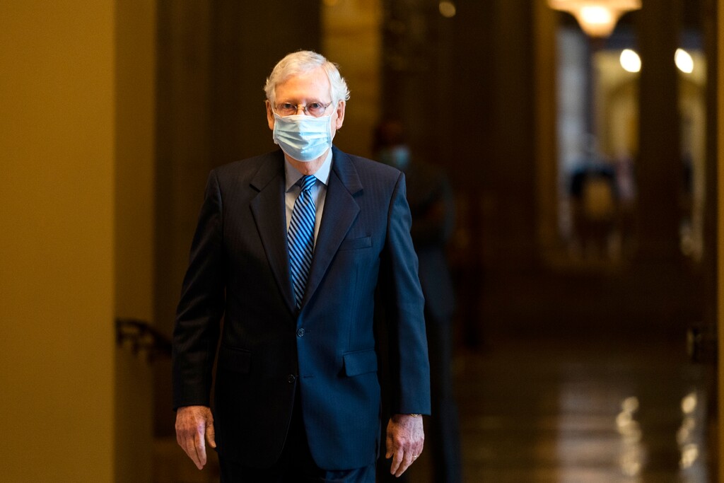 FILE - In this Oct. 1, 2020, file photo Senate Majority Leader Sen. Mitch McConnell of Ky. walks towards the Senate floor on Capitol Hill in Washington. New virus relief will have to wait until after the November election. The architect of the Senate measure, McConnell, isn’t claiming the vote will advance the ball. Once the measure fails, he plans to turn the chamber's full attention to cementing a 6-3 conservative majority on the Supreme Court by confirming Judge Amy Coney Barrett. (AP Photo/Manuel Balce Ceneta, File)
