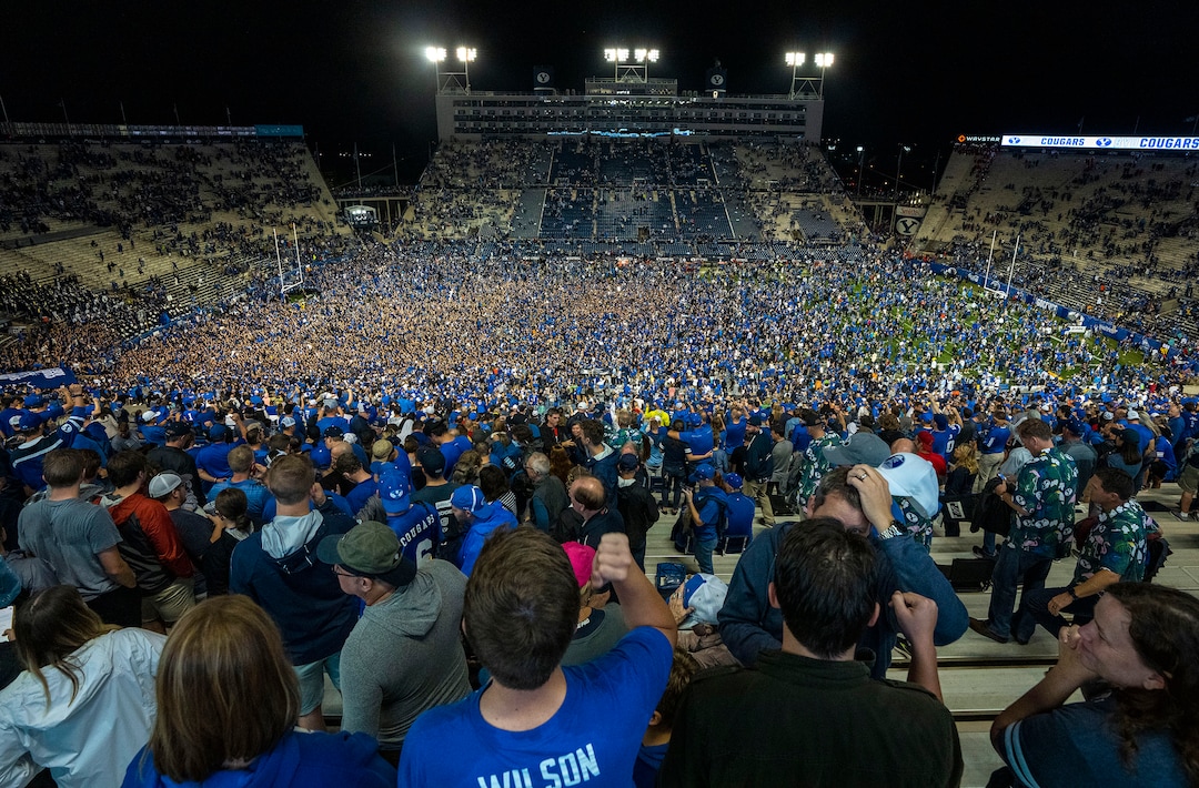 (Rick Egan | The Salt Lake Tribune) BYU fans storm the field as the Brigham Young Cougars defeat the Utah Utes 26-17, at Lavell Edwards Stadium in Provo, on Saturday, Sept. 11, 2021.