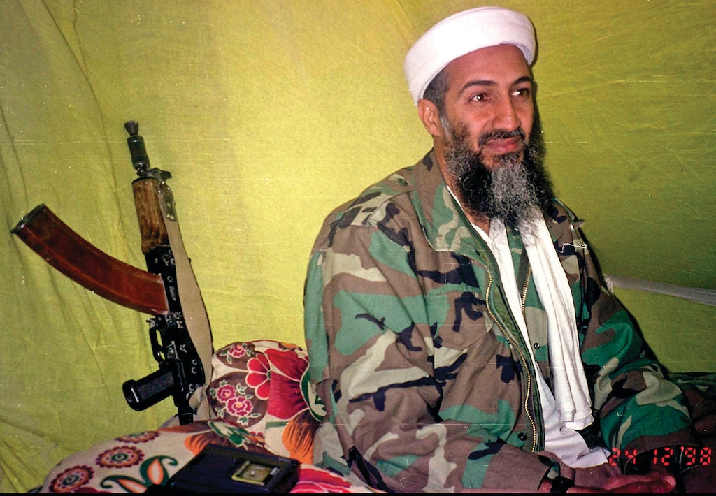 FILE - In this Dec. 24, 1998, file photo, al-Qaida leader Osama Bin Laden speaks to a selected group of reporters in mountains of Helmand province in southern Afghanistan. (AP Photo/Rahimullah Yousafzai, File)