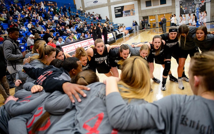 (Trent Nelson | The Salt Lake Tribune)  Northridge players huddle up before the game as Bingham faces Northridge in the 6A High School Girls' Basketball Tournament at SLCC in Taylorsville, Thursday Feb. 22, 2018.