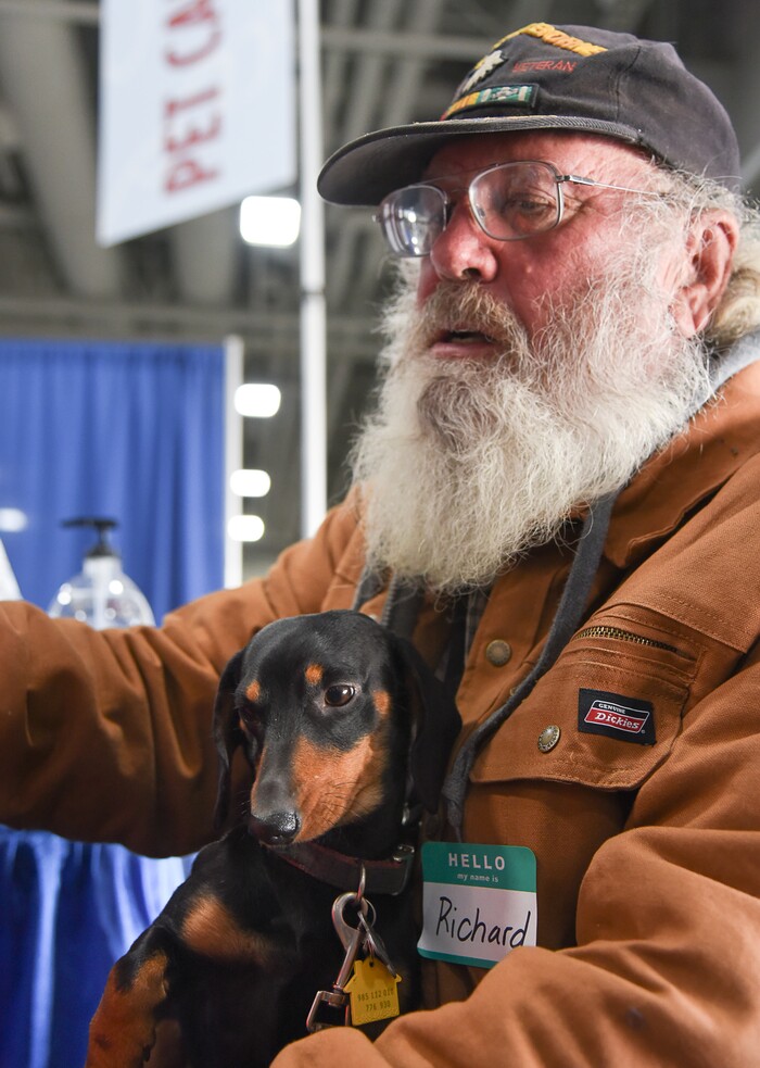 (Francisco Kjolseth  |  The Salt Lake Tribune)  Richard Frauenthal of Tallahassee Florida holds his dog "Little Bit" as he gets services for his three small dogs during Salt Lake CityÕs second annual Project Homeless Connect at the Salt Palace Convention Center on Friday, Oct. 12, 2018. More than 800 community volunteers and 90 service providers connect those in need with more than 200 services.