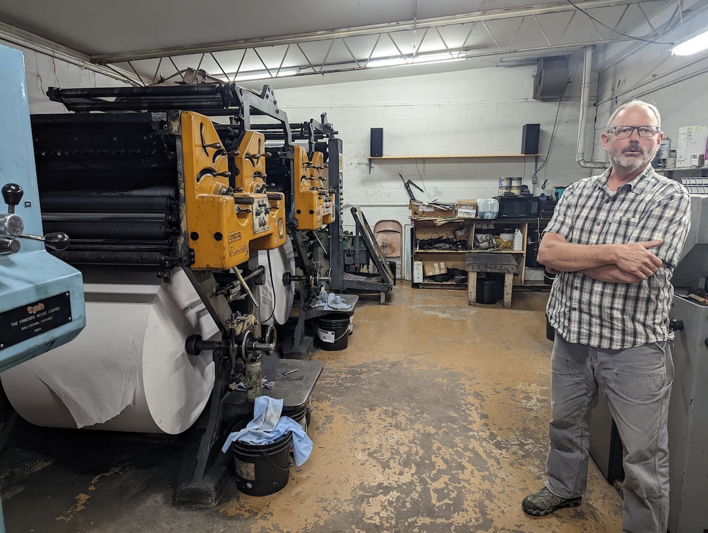 Zane Taylor with the Moab Times-Independent's printing press.