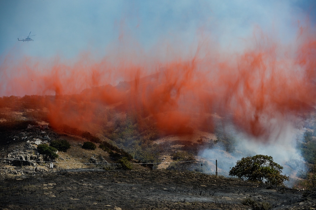 (Francisco Kjolseth  |  The Salt Lake Tribune)  Fire Crews direct a slurry bomber to unload its payload along the East Bountiful bench that grew to 150 acres early Friday morning, Aug. 30, 2019, and destroyed three homes. On Sept. 2, officials said the fire was 100% contained.