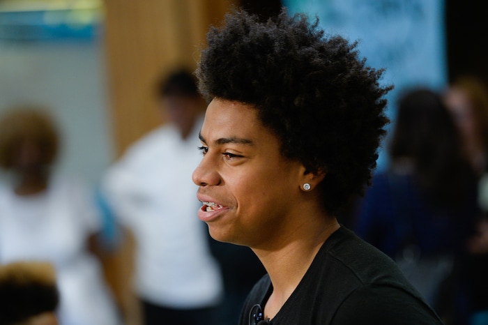 (Francisco Kjolseth  |  The Salt Lake Tribune)  Kearns High sophomore Keeven Wilson, 16, speaks with the media after being announced as the Granite School District's Absolutely Incredible Kid award winner during the school farewell assembly on Tuesday, May 22, 2018. Wilson who had a particularly difficult home life, to the point that he and his siblings were taken away from his parents and near universal F's during his junior high days turned his life around.  With the help of a new foster family, teachers and his football coach, he is now an honor roll student and thinking of studying psychology in college.