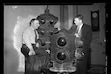 (The Salt Lake Tribune) Lester Wire, at right, N.W. Silver and a pair of later metal traffic lights in 1940.