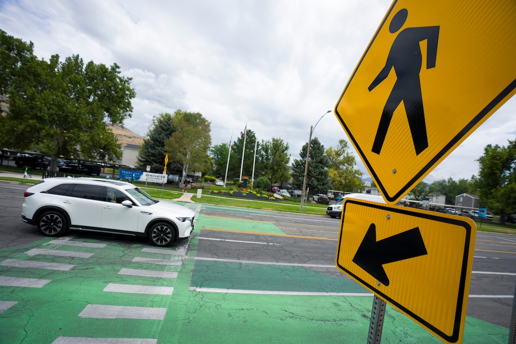 (Bethany Baker  |  The Salt Lake Tribune) A car passes the crosswalk at 800 North and 900 West in Salt Lake City on Wednesday, July 22, 2026.