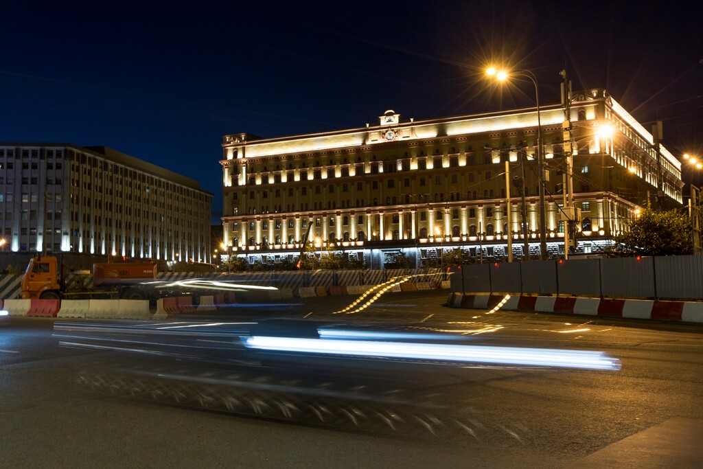 In this photo taken on Monday, July 24, 2017, a car passes the building of the Federal Security Service (FSB, Soviet KGB successor) in Lubyanskaya Square in Moscow, Russia. The U.S. has orchestrated the arrest of five alleged Russian cybercriminals across Europe in the past nine months. The operations come at a fraught moment in relations between Russia and the U.S., where politicians are grappling with the allegation that Kremlin hackers intervened in the 2016 election. (AP Photo/Alexander Zemlianichenko)