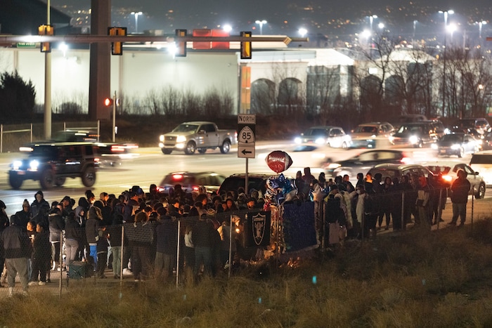 (Francisco Kjolseth | The Salt Lake Tribune) More that a hundred people gather at the candlelight vigil of Hunter High football players Paul Tahi , 15, Tivani Lopati, 14, and Ephraim Asiata, 15, on Friday, Jan 14, 2022, in West Valley City, near Hunter High School along 1400 South at Mountain View Corridor. Paul Tahi and Tivani Lopati were killed in a shooting, while Ephraim Asiata remains in critical condition.