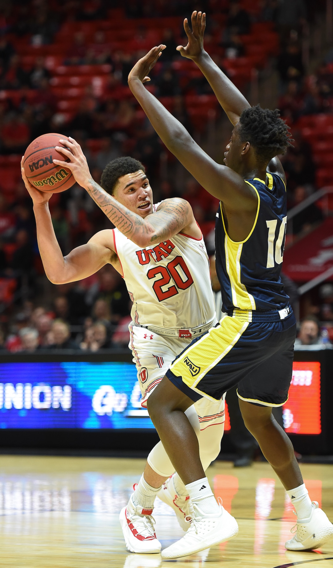 (Francisco Kjolseth  |  The Salt Lake Tribune)  Utah Utes forward Timmy Allen (20) looks to get past Northern Arizona Lumberjacks forward Bernie Andre (10) during the second half of an NCAA basketball college basketball game at the Jon M. Huntsman Center in Salt Lake City, Ut., Friday Dec. 21, 2018.