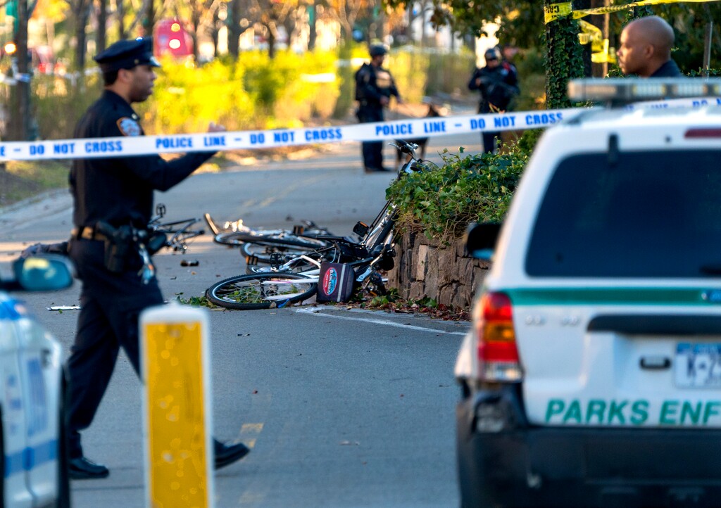 Bicycles and debris lay on a bike path after a motorist drove onto the path near the World Trade Center memorial, striking and killing several people Tuesday, Oct. 31, 2017. (AP Photo/Craig Ruttle)