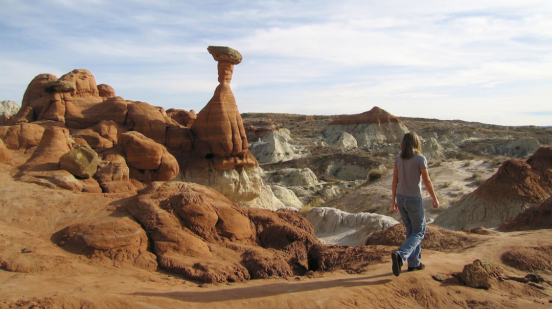 (Al Hartmann  |  The Salt Lake Tribune) 	Hiker explores the Paria Toadstools, an easy one mile hike north of Highway 89 between Kanab and Page, AZ.  It lies within the old boundaries of the Grandstaircase Escalante National Monument. 