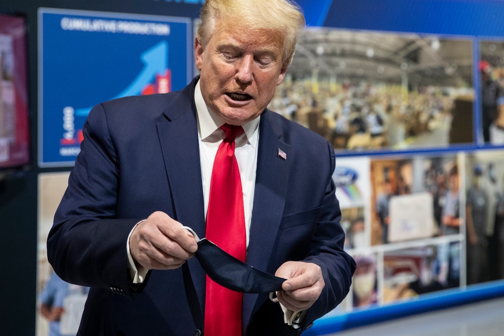 (Alex Brandon | AP file photo)  President Donald Trump holds his protective face  mask as he speaks while touring Ford's Rawsonville Components Plant that has been converted to making personal protection and medical equipment, Thursday, May 21, 2020, in Ypsilanti, Mich.