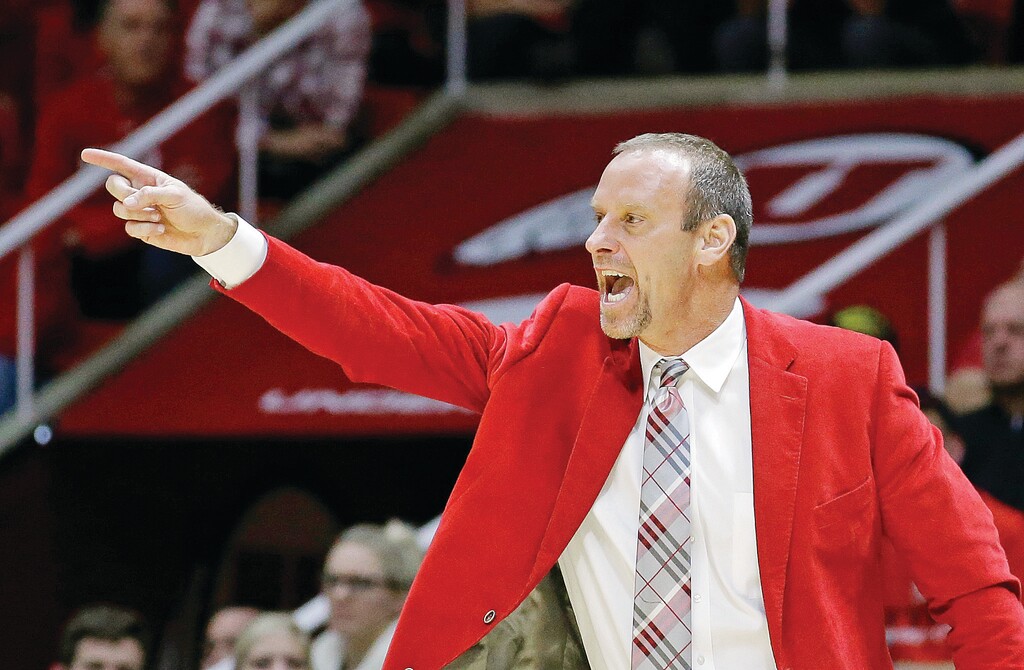 Utah head coach Larry Krystkowiak shouts to his team in the second half during an NCAA college basketball game against BYU Wednesday, Dec. 2, 2015, in Salt Lake City. (AP Photo/Rick Bowmer)