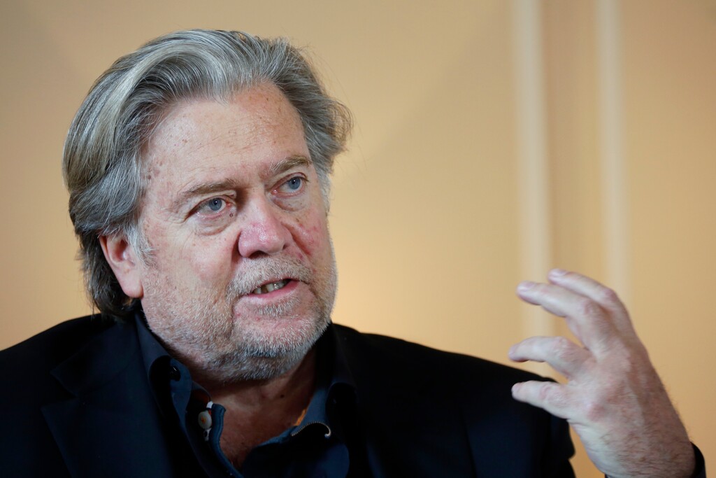 (Thibault Camus | AP) In this May 27, 2019 file photo, former White House strategist Steve Bannon pauses prior to an interview in Paris. Bannon was arrested Thursday, Aug. 20, 2020, on charges that he and three others ripped off donors to an online fundraising scheme “We Build The Wall.”
