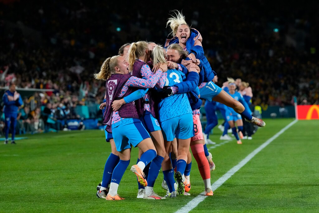 (Abbie Parr | AP) England's team players celebrate after Alessia Russo scored her side's third goal during the Women's World Cup semifinal soccer match between Australia and England at Stadium Australia in Sydney, Australia, Wednesday, Aug. 16, 2023.