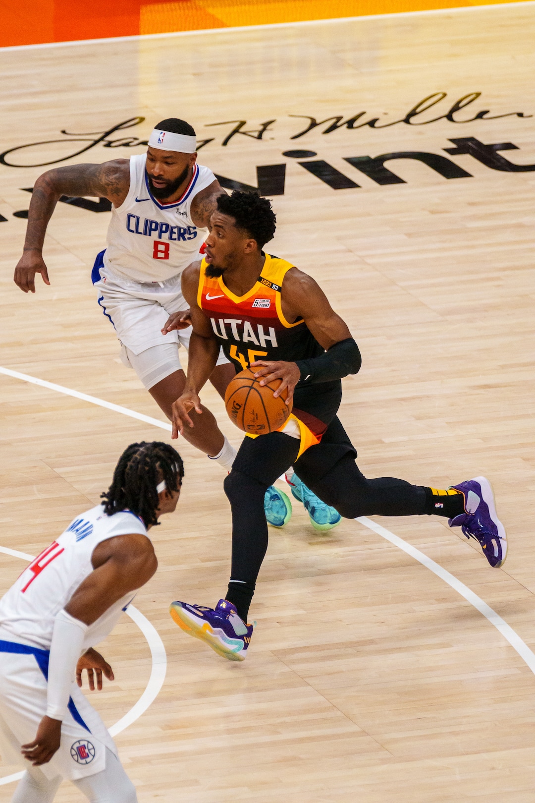 (Trent Nelson  |  The Salt Lake Tribune) Utah Jazz guard Donovan Mitchell (45) drives past LA Clippers forward Marcus Morris Sr. (8) as the Utah Jazz host the Los Angeles Clippers in a Game 5 matchup, NBA basketball in Salt Lake City on Wednesday, June 16, 2021.