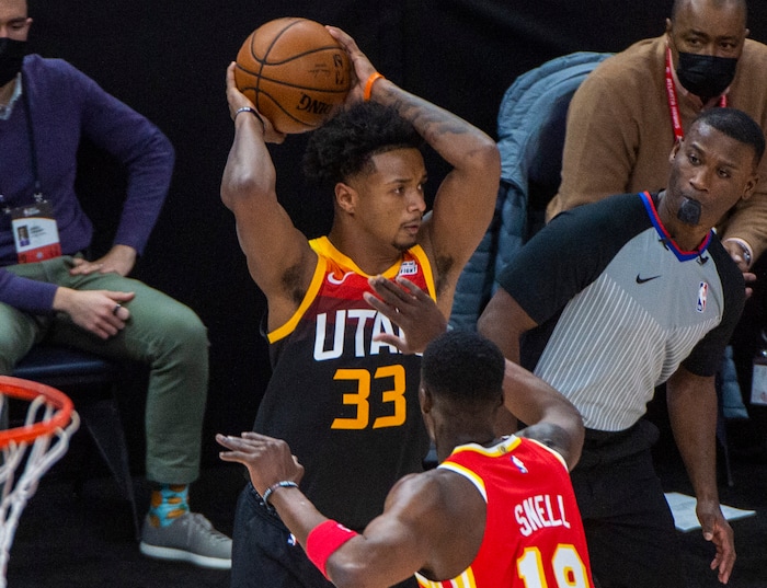 (Rick Egan | The Salt Lake Tribune) Utah Jazz forward Elijah Hughes (33) us guarded by Atlanta Hawks guard Tony Snell (19), in NBA action between the Utah Jazz and the Atlanta Hawks at Vivint Arena, on Friday, Jan. 15, 2021.