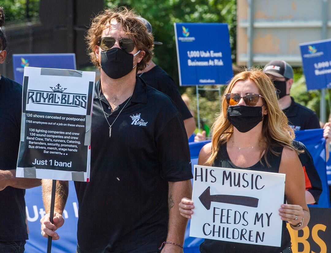 (Rick Egan  |  The Salt Lake Tribune)     Neal Middleton from the band Royal Bliss and his wife Linzie  march to the State Capitol with more than 100 members of the Utah Live Events Industry Association, in a silent march to call attention to the state of their industry, on Tuesday, July 21, 2020.
