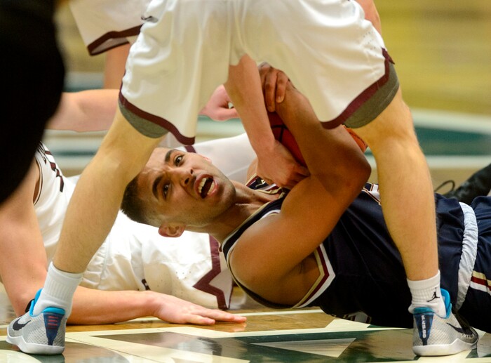 (Steve Griffin  |  The Salt Lake Tribune) Herriman's Jael Vaughn holds the ball as he looks to the ref for a time-out during 6A basketball playoff game against Lone Peak at the Utah Valley UniversityÕs UCCU Center in Provo Tuesday Feb. 27, 2018.